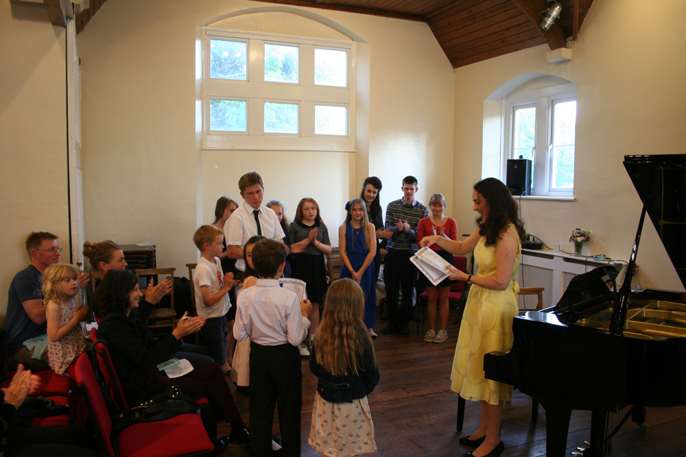 Certificates being presented at the Student Recital at St John's, Bath